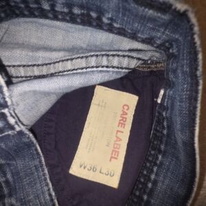 Men's Dark Blue Bootcut Jeans with Care Label Waist W36